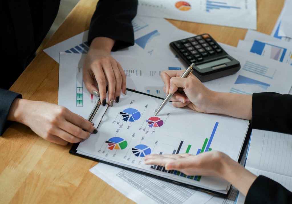 Female accountant team is analyzing data to present the client.